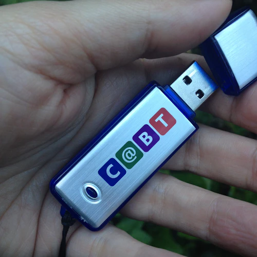 a CABT flash drive in a persons hand
