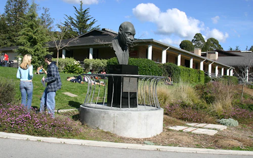 MLK statue with bldg 100 in the background