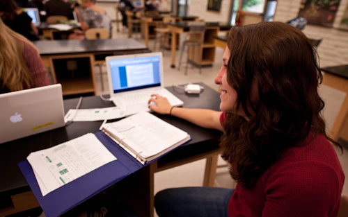student sitting in front of a computer