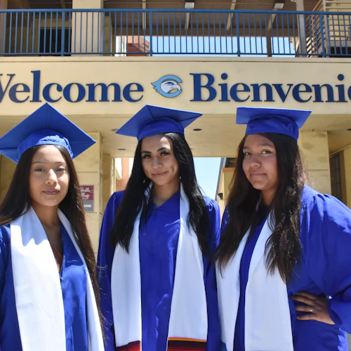 three girls with caps and gowns