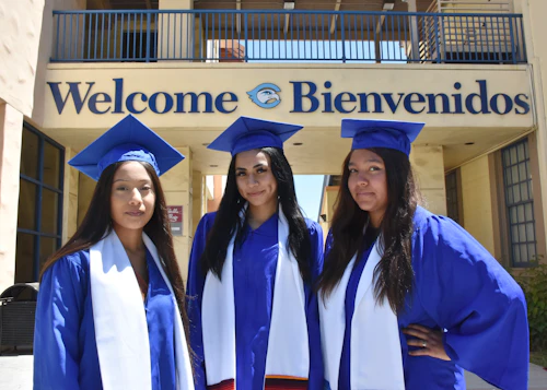 three girls with caps and gowns