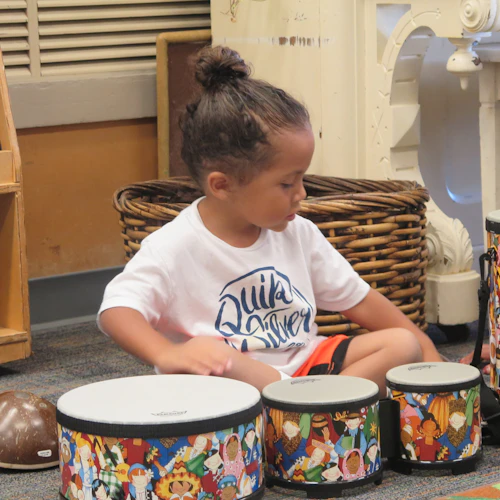 Child playing the drums