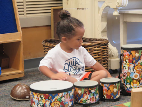 Child playing the drums