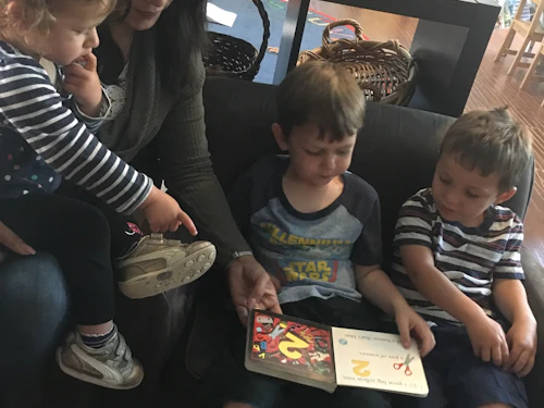 Mariana reading to students