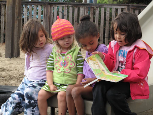 young students reading in the park