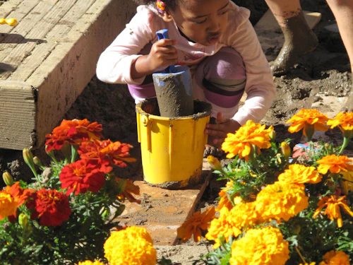 child picking flowers