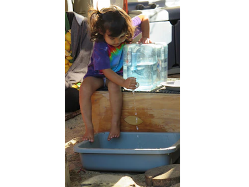 toddler with water