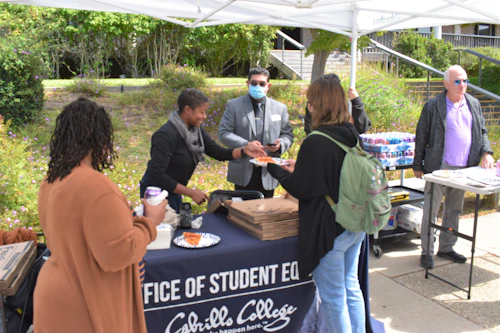 Staff and Student Assistants Serving Pizza at OSE Open House