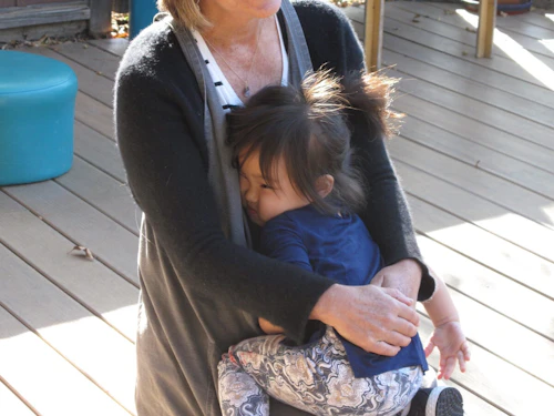 Nancy holding a toddler