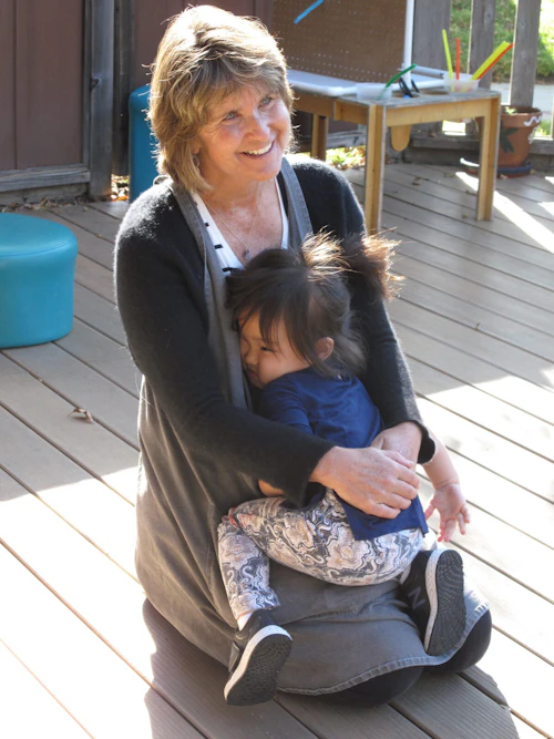 Nancy holding a toddler