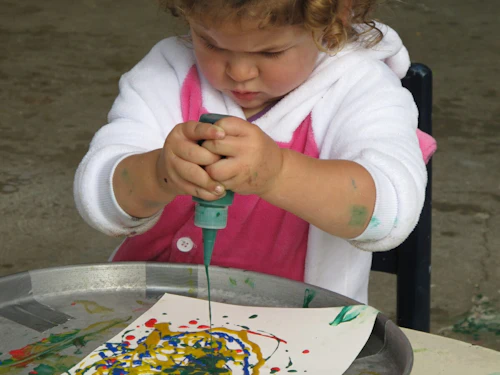 child playing with art