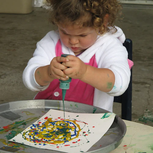 child playing with art
