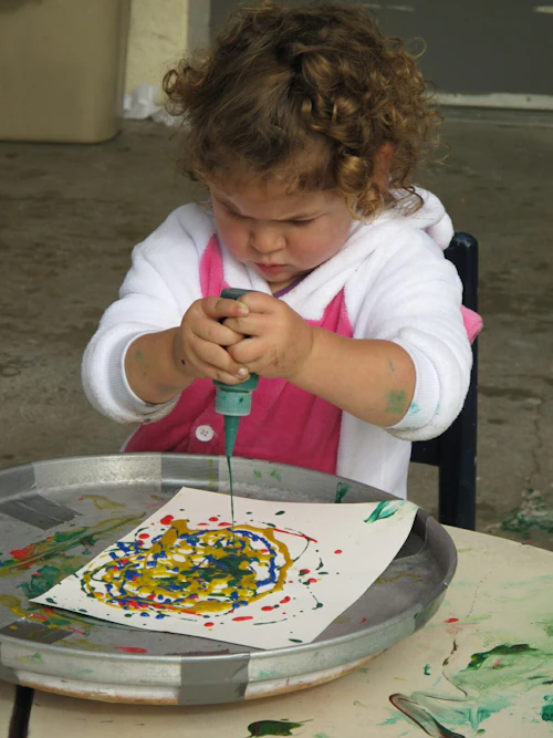child playing with art