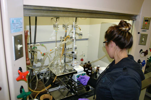 Student performing distillation