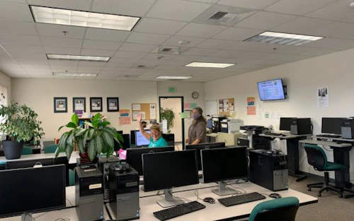 woman waving in a lab