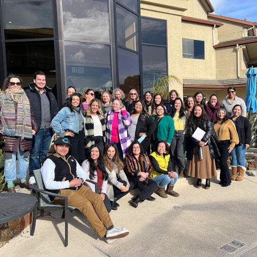 Academic Counseling Team outside seated and standing in three rows in a half circle