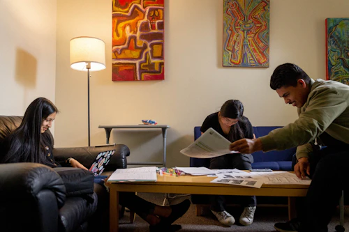 3 students study on sofas