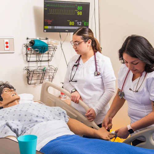 nursing students practicing in lab