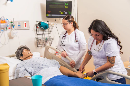 nursing students practicing in lab