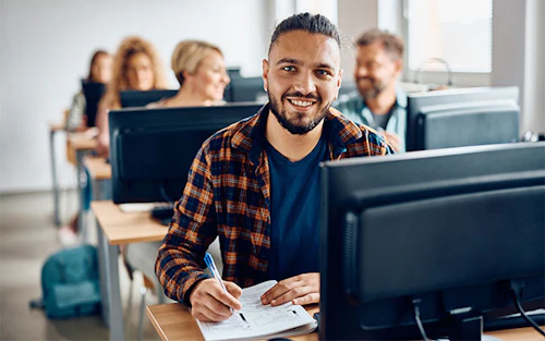 student in class smiling