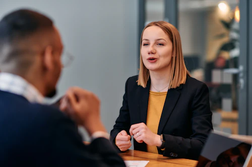 a female professional being interviewed for a job
