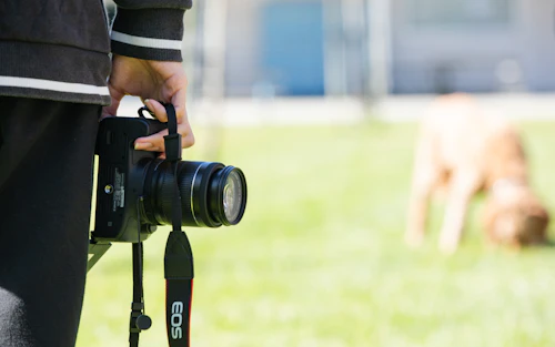 student holding a camera
