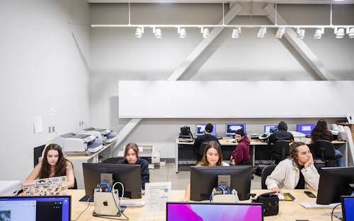 students in the classroom with computers