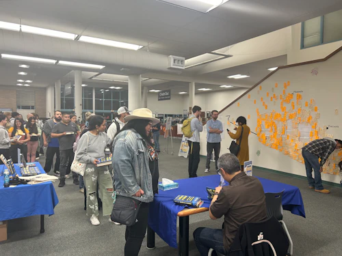 Jason De Leon signs books in the Cabrillo Library