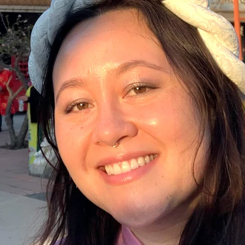 Tritia posing for the photo with a friendly expression.