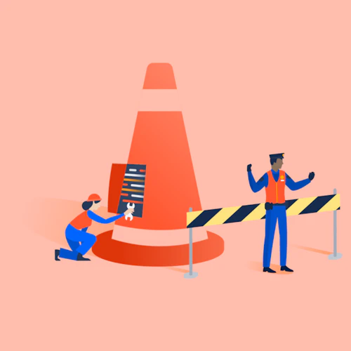 Una trabajadora de mantenimiento abre un panel en un gran cono mientras un trabajador masculino detiene el tráfico.