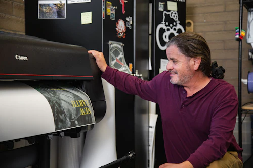 student waiting for a print