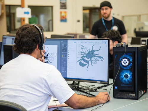 student editing an image on the computer