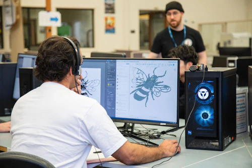 student editing an image on the computer