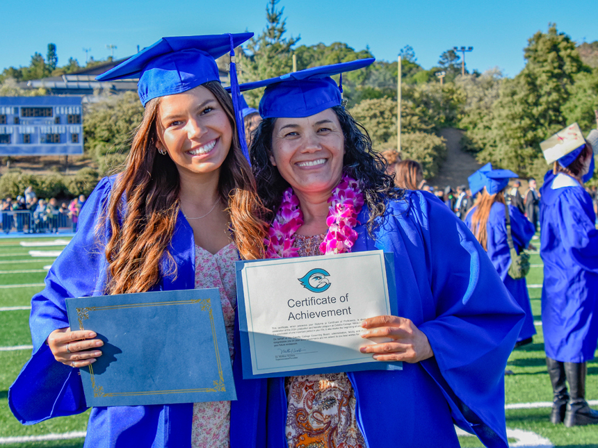 Cabrillo students with their diploma and certificate at graduation