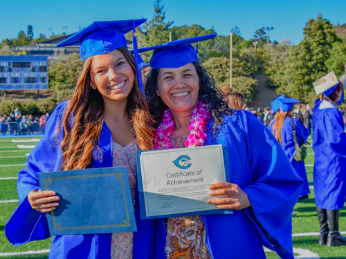 Cabrillo students with their diploma and certificate at graduation