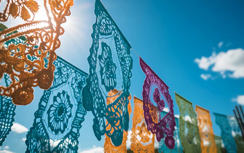 papel picado banners hanging in the sun