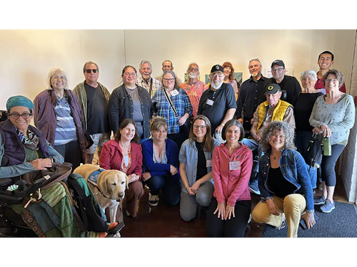a group of people on a field trip with the Stroke Center pose together for a photo