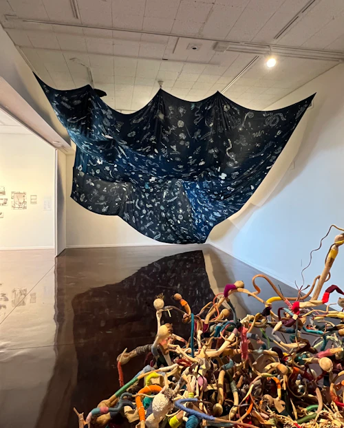 back gallery left corner view, Tanja Geis "Casting, Sinking, Feeling", cyanotype on viscose, hanging hardware, string