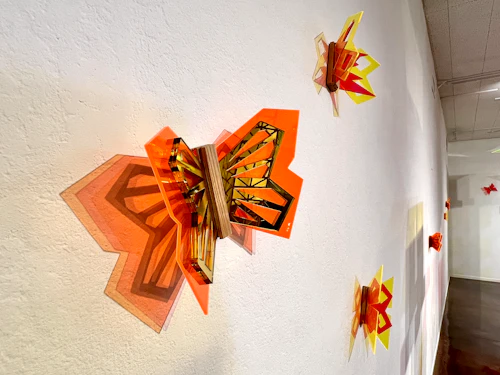 wall installation detail view, "Untitled (Monarch Butterfly)", acrylic mirror, plexiglas and wood