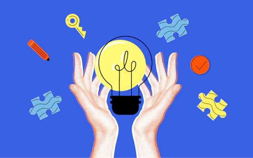 hands holding a light bulb with puzzle pieces in the background