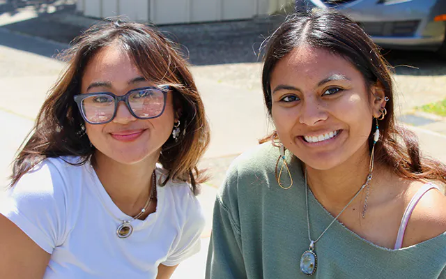 two Cabrillo students smile at the camera