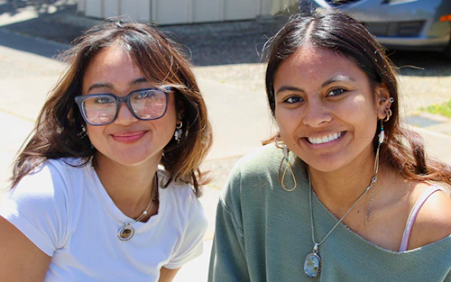 two Cabrillo students smile at the camera
