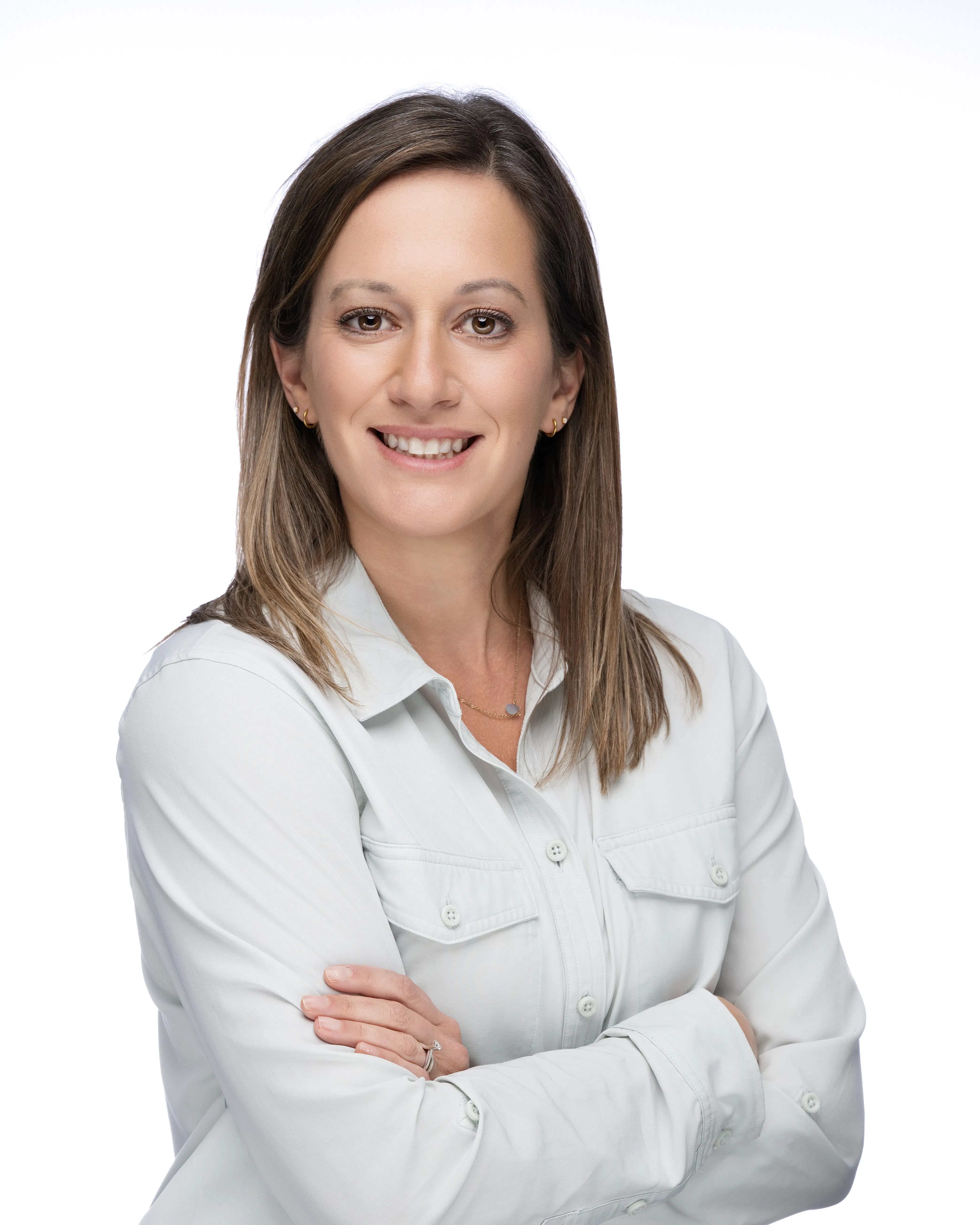Headshot of Jenna Zeller, Nursing Faculty and Assistant Director of Nursing, smiling in a white collared shirt.
