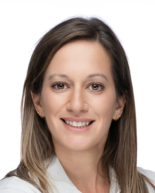 Headshot of Jenna Zeller, Nursing Faculty and Assistant Director of Nursing, smiling in a white collared shirt.