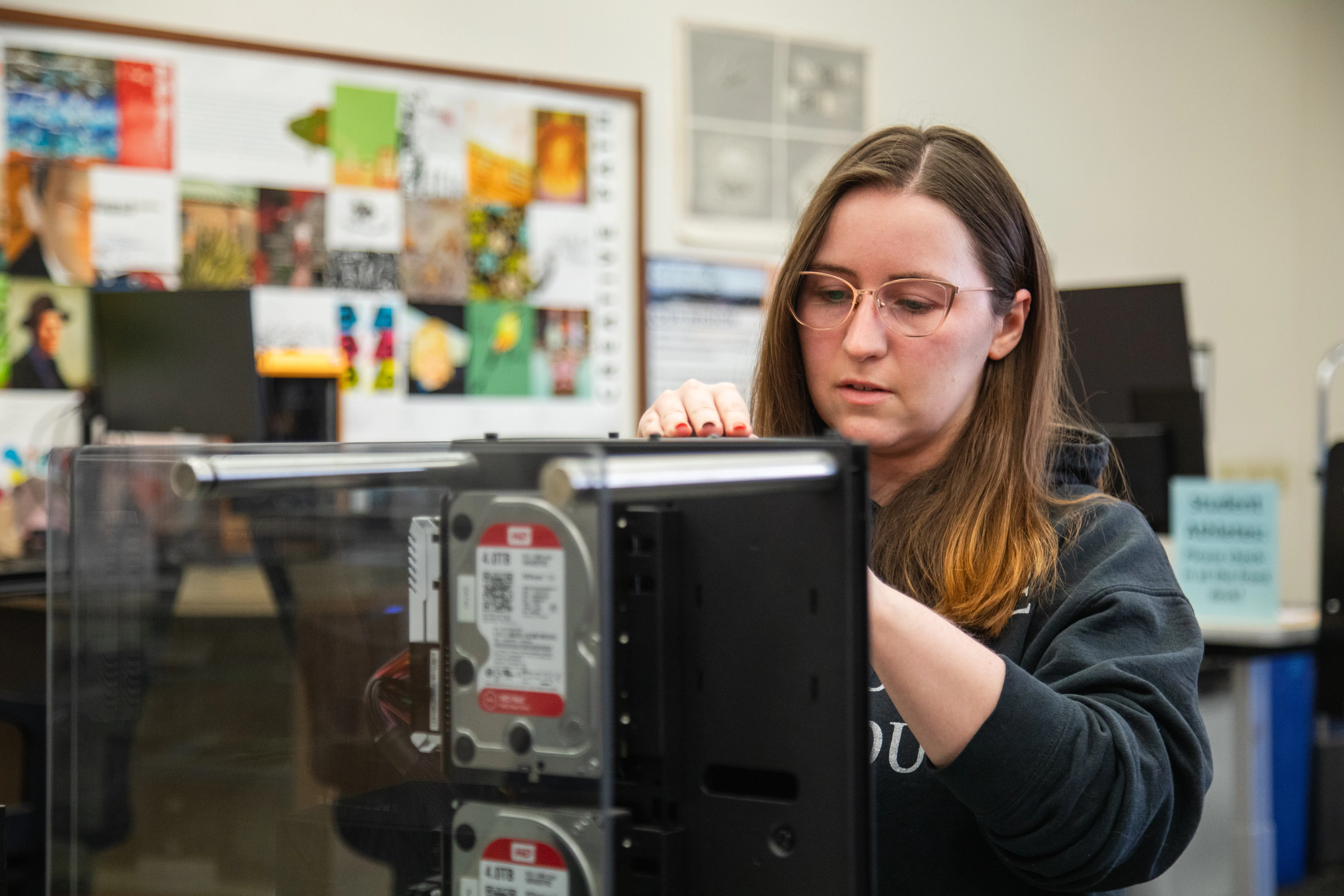 Student Assistant working on computer